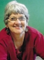 Terri Lynch a smiling, silver-haired lady with glasses